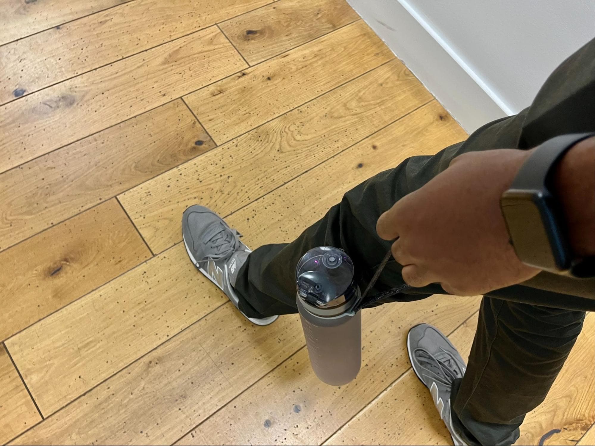 Walking wearing my fitbit and a bottle of water indoors