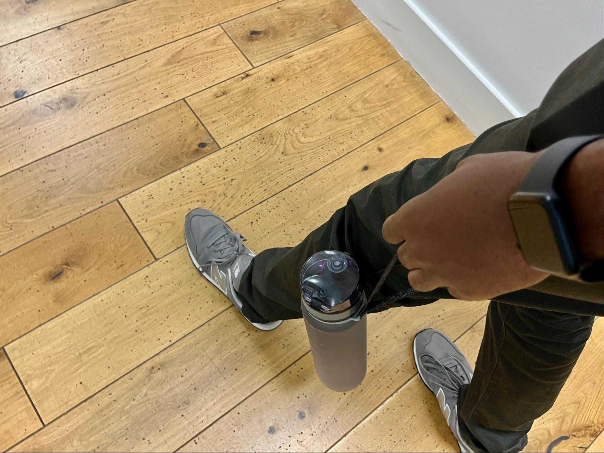 Walking wearing my fitbit and a bottle of water indoors
